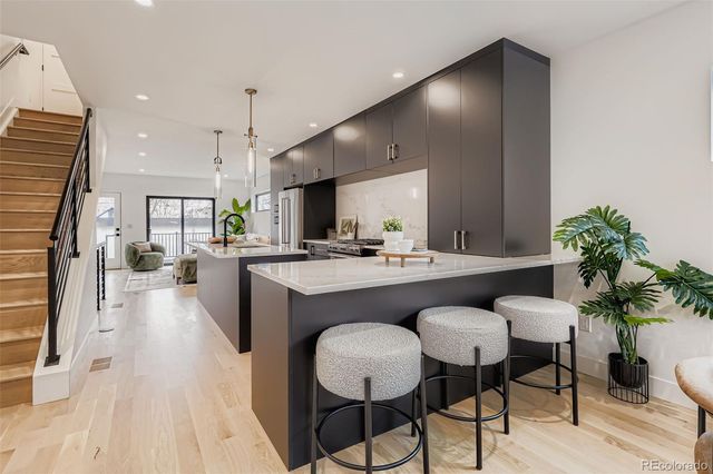 a view of kitchen with cabinets and wooden floor