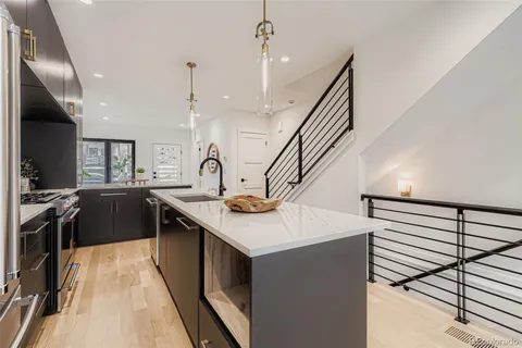 a kitchen with a sink and stove