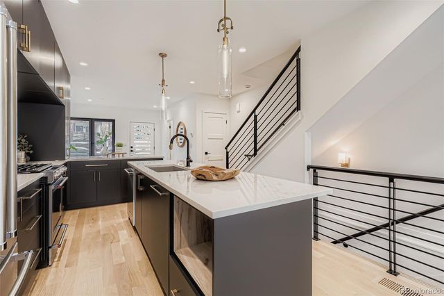 a kitchen with a sink and stove