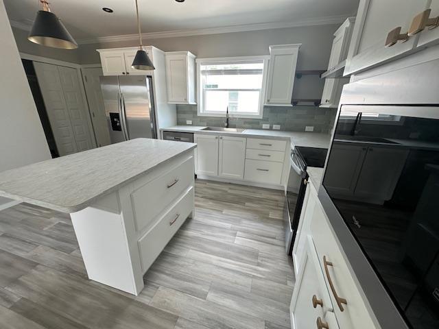202 Skipjack Lane Freeport, FL 32439 - Photo 3 of 10 a kitchen with a sink a refrigerator and window