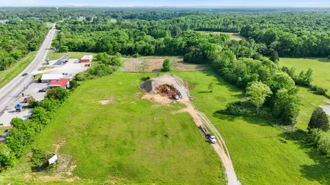 a view of a lake with a yard