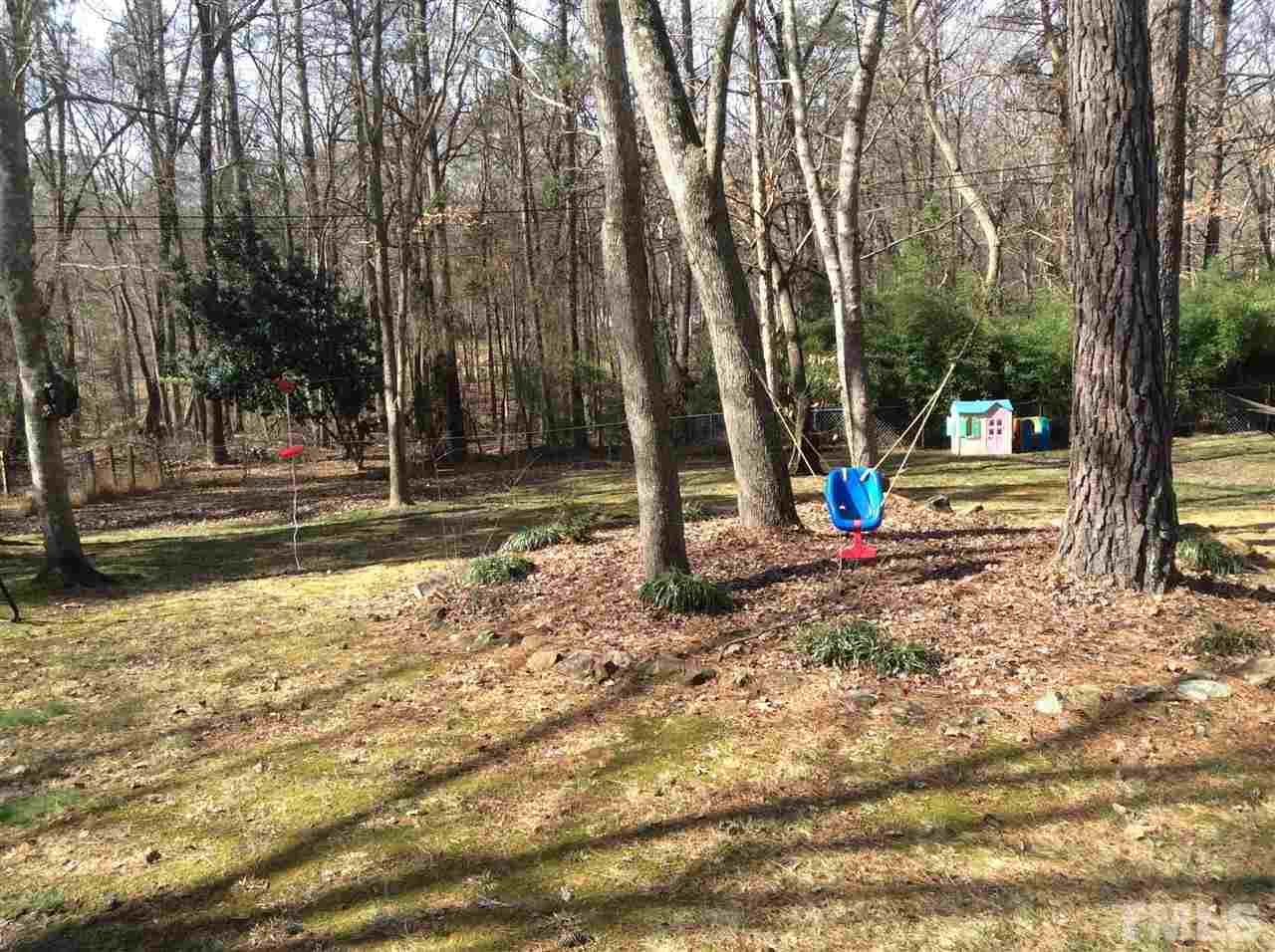 6735 Johnson Mill Road Durham, NC 27712 - Photo 18 of 18 a view of outdoor space with playground and green space
