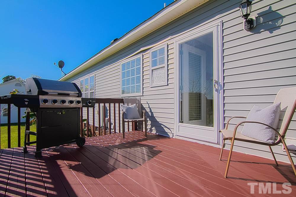 1409 Jenny Ridge Lane Willow Spring, NC 27592 - Photo 20 of 22 a view of a chairs on the deck