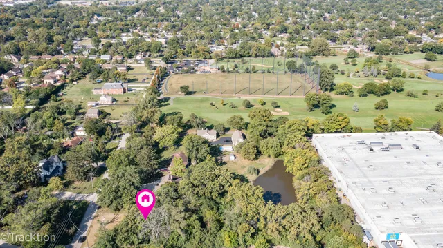 a huge green field with lots of trees