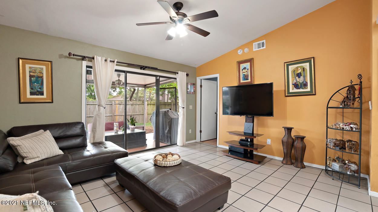 2360 Bitternut Way Jacksonville, FL 32246 - Photo 15 of 26 a living room with furniture and a flat screen tv