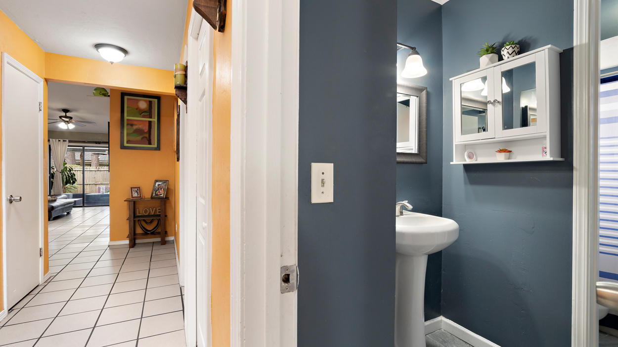 2360 Bitternut Way Jacksonville, FL 32246 - Photo 3 of 26 a view of a bathroom with sink and mirror
