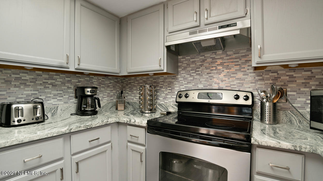 2360 Bitternut Way Jacksonville, FL 32246 - Photo 8 of 26 a kitchen with granite countertop cabinets stainless steel appliances and sink