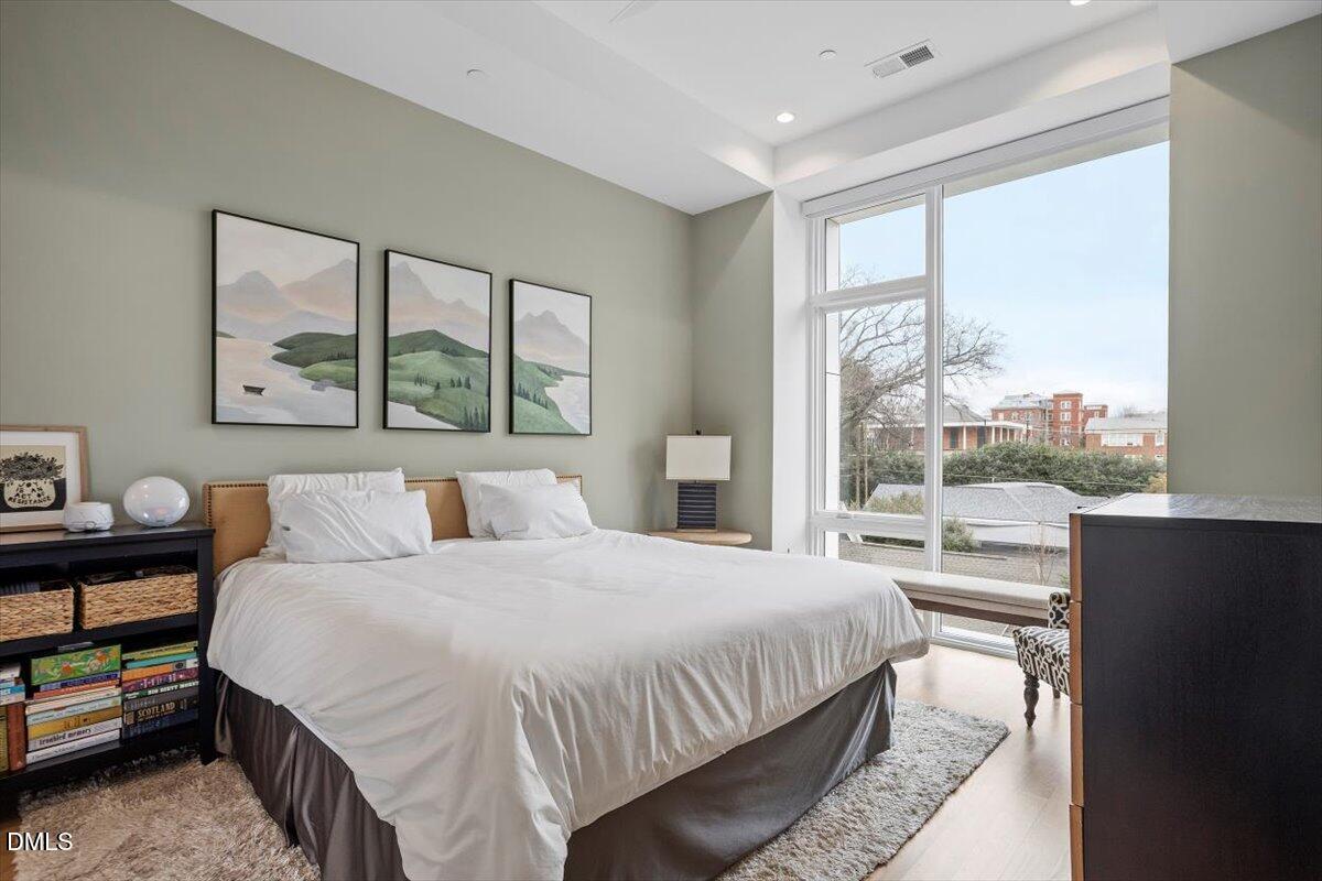 206 Dundas Lane Raleigh, NC 27603 - Photo 5 of 30 a bedroom with a bed and a large window