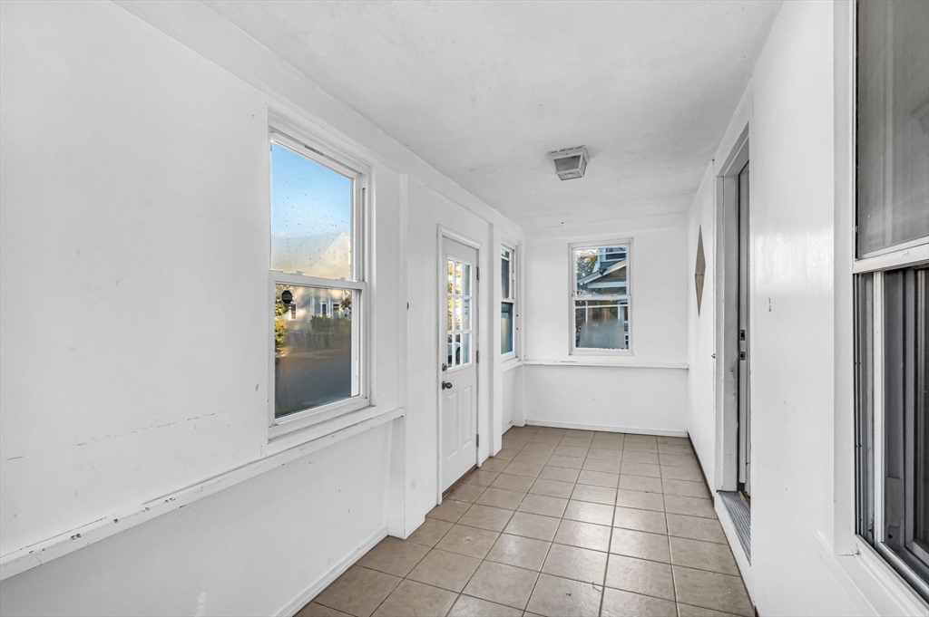 29 Wareham Street Springfield, MA 01108 - Photo 16 of 38 a view of a hallway with white walls and stairs