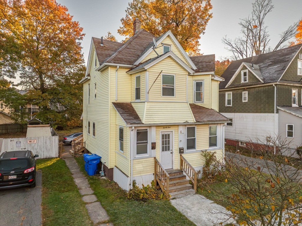 29 Wareham Street Springfield, MA 01108 - Photo 2 of 38 a view of a white house next to a yard with big trees