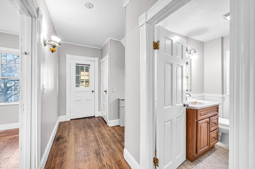 29 Wareham Street Springfield, MA 01108 - Photo 4 of 38 a view of a livingroom with wooden floor and a bathroom