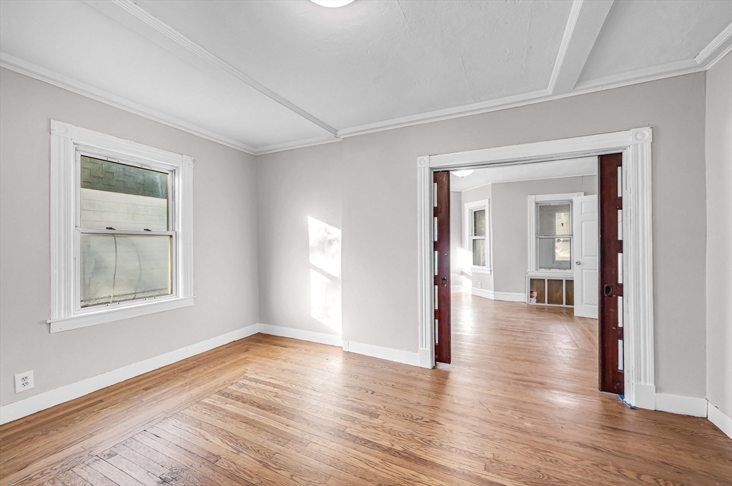 29 Wareham Street Springfield, MA 01108 - Photo 10 of 38 a view of a room with wooden floor and windows