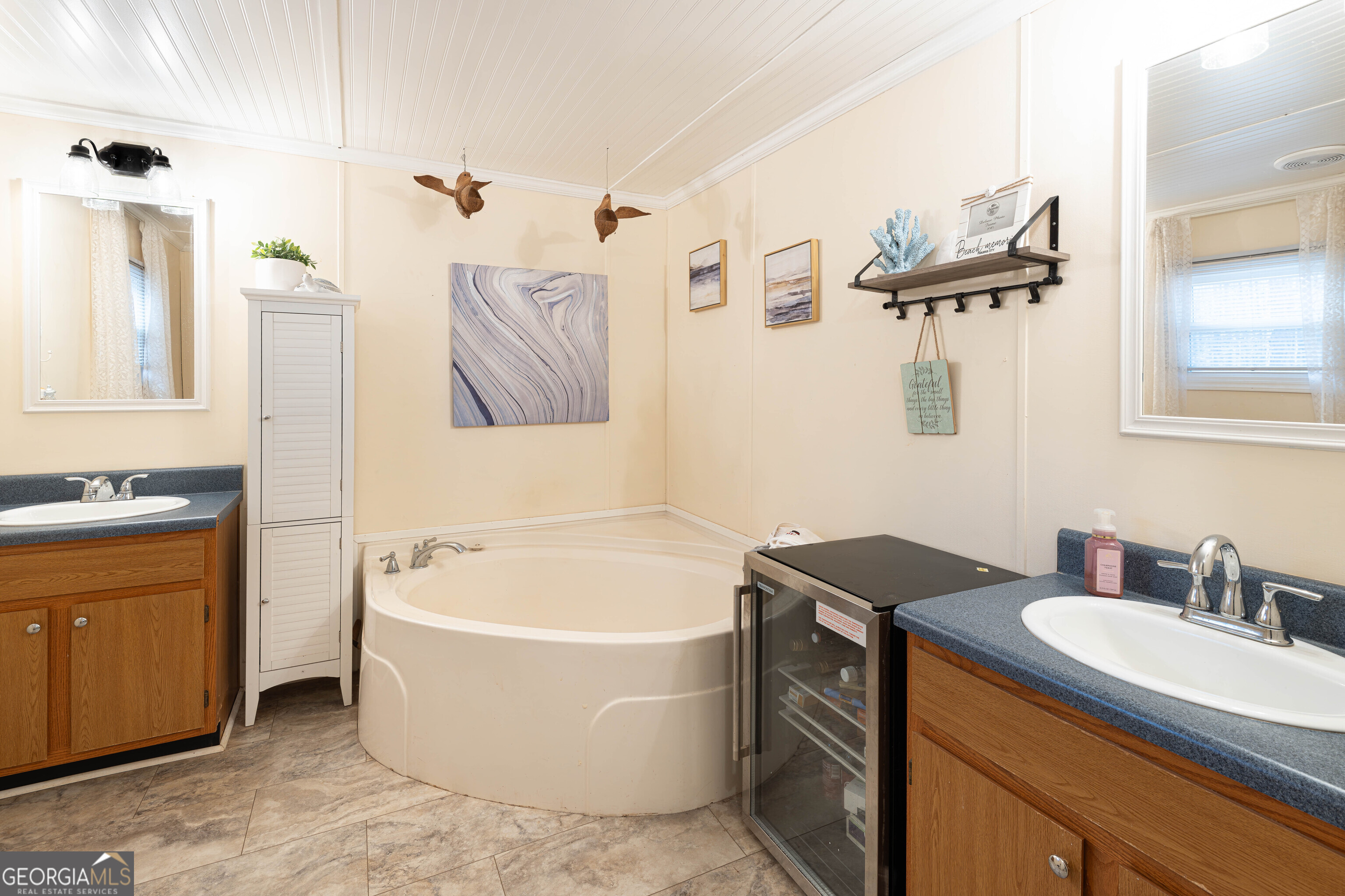 161 Cherokee Trail Forsyth, GA 31029 - Photo 15 of 32 a bathroom with a tub sink and mirror
