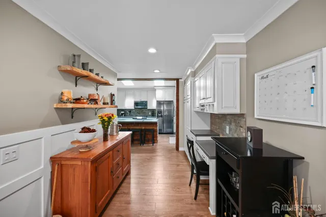 a spacious bedroom with a bed and storage