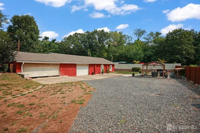an aerial view of a residential houses with city view