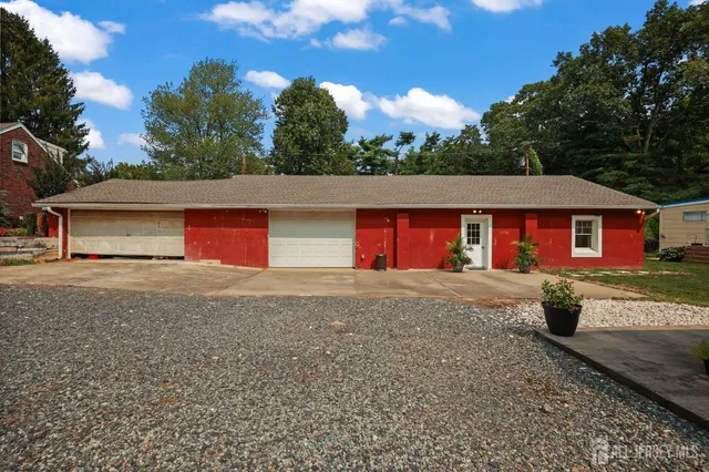 an aerial view of house with yard swimming pool and outdoor seating