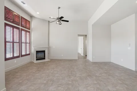 a view of empty room with fireplace