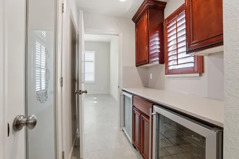 a hallway with a sink and a window