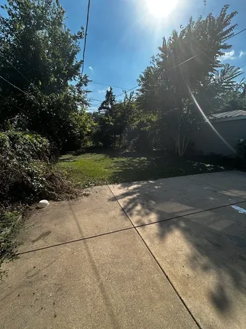 a view of backyard with green space