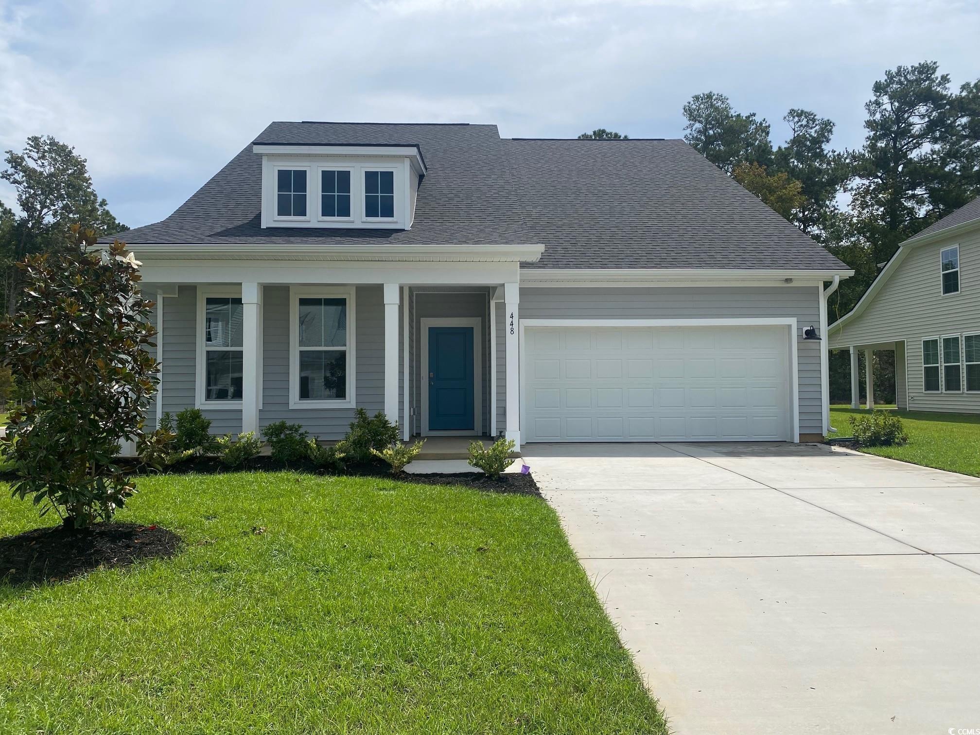 448 Joseph Street Longs, SC 29568 - Photo 1 of 1 View of front of house featuring a front lawn, cov