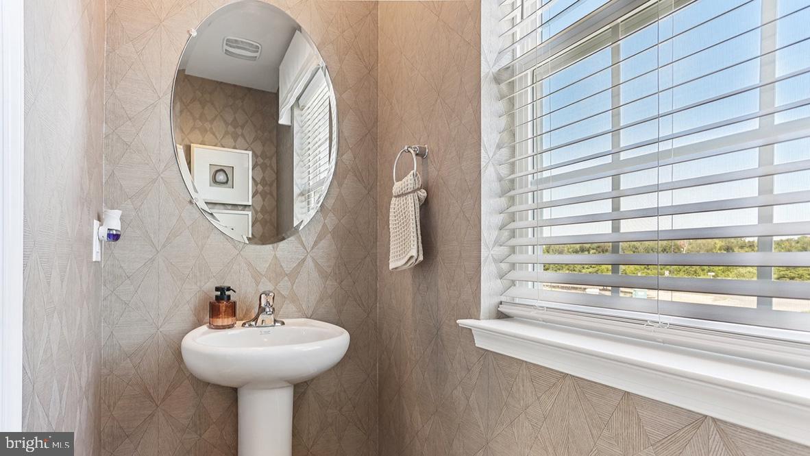 115 Clinton Street Sicklerville, NJ 08081 - Photo 21 of 60 a bathroom with a sink and mirror