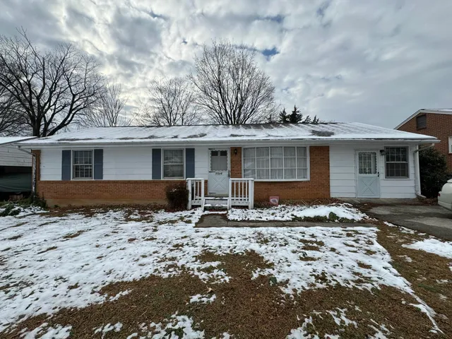 a front view of a house with yard