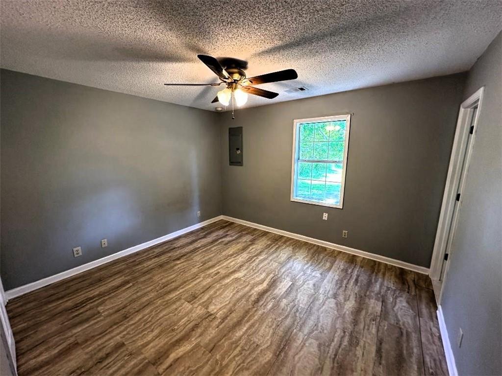 159 Guyton Road Northwest Sugar Valley, GA 30746 - Photo 8 of 12 wooden floor in an empty room with a window