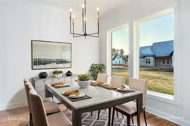 a kitchen with stainless steel appliances granite countertop a sink a refrigerator and a stove