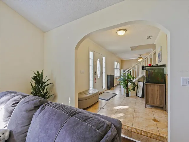 a living room with fireplace furniture and a flat screen tv