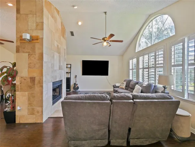 a living room with furniture and a fireplace