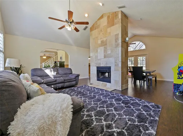 a living room with furniture and a fireplace