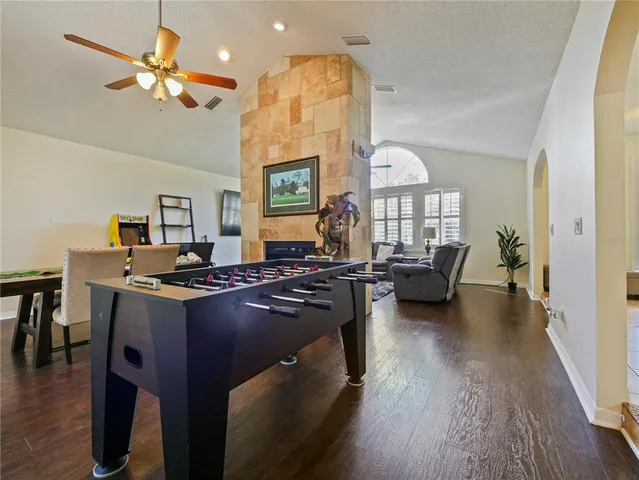 a view of a dining room with furniture wooden floor and a chandelier