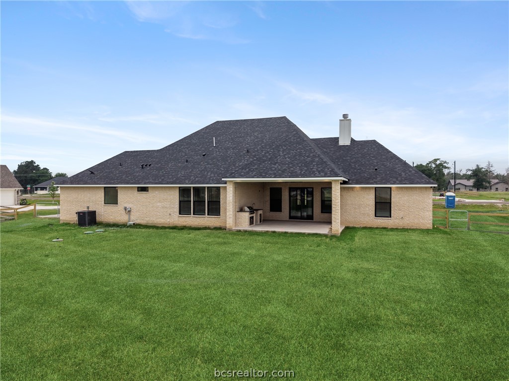 7822 Mathis Crk Drive Bryan, TX 77808 - Photo 41 of 43 a front view of a house with yard