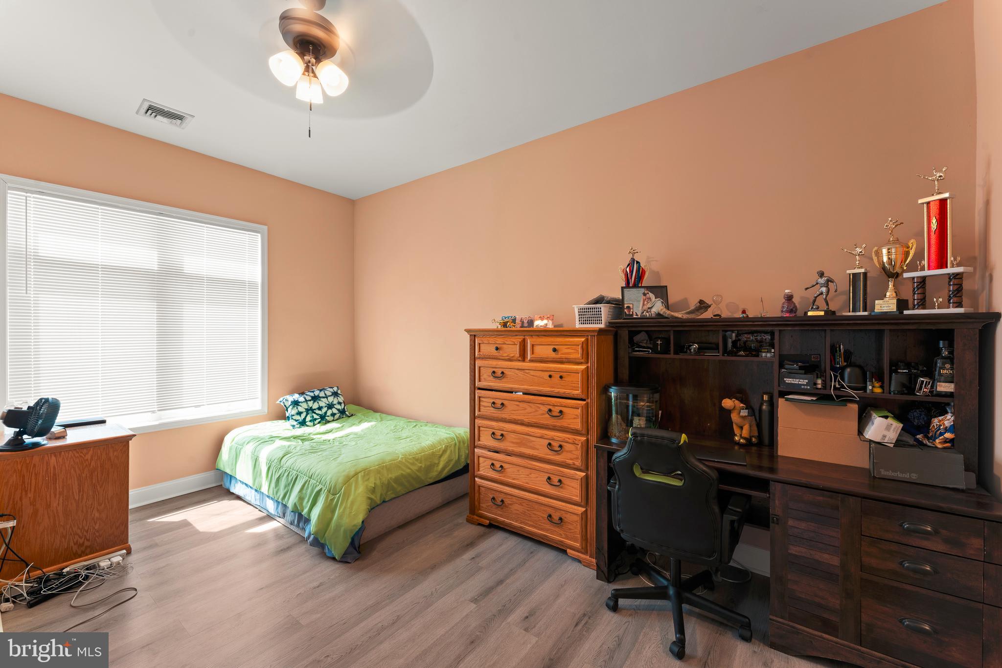 516 Carson Terrace Huntingdon Valley, PA 19006 - Photo 14 of 29 a bedroom with a bed and a bookshelf