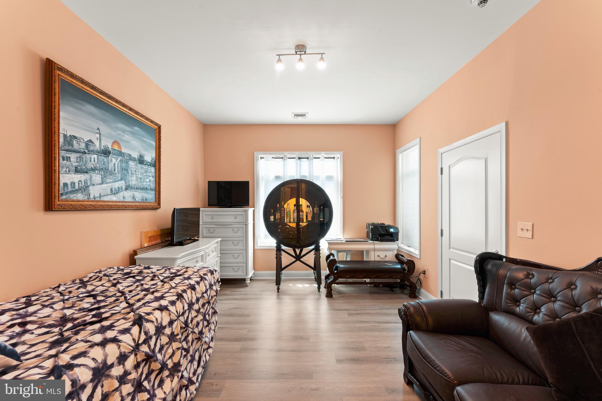 516 Carson Terrace Huntingdon Valley, PA 19006 - Photo 16 of 29 a living room with furniture a fireplace and a large mirror