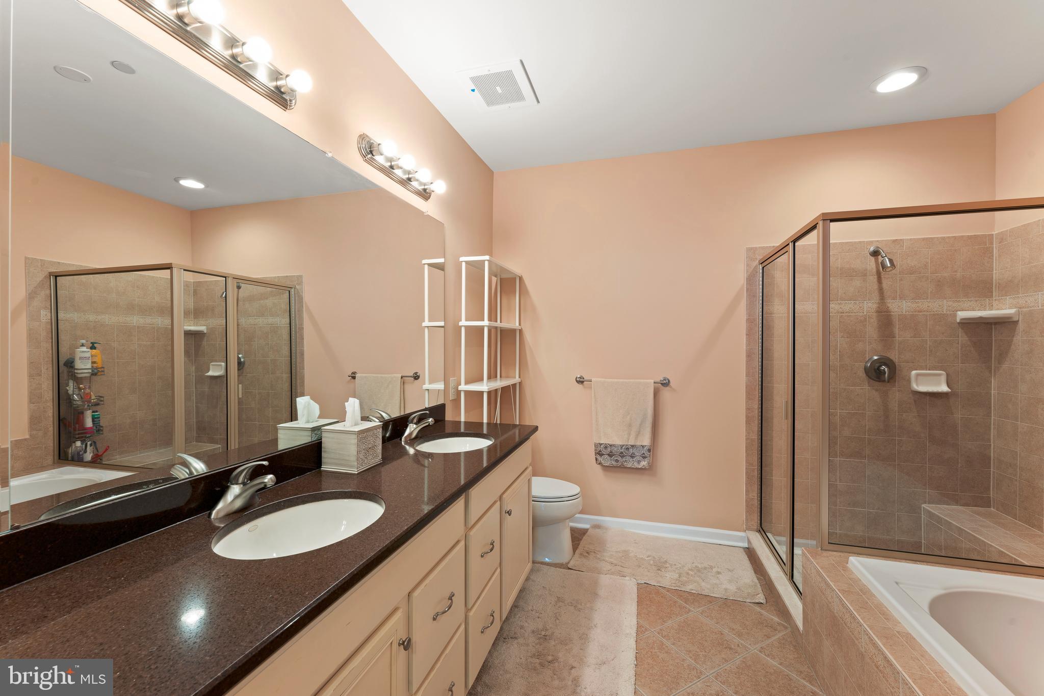 516 Carson Terrace Huntingdon Valley, PA 19006 - Photo 17 of 29 a bathroom with a double vanity sink and mirror with shower