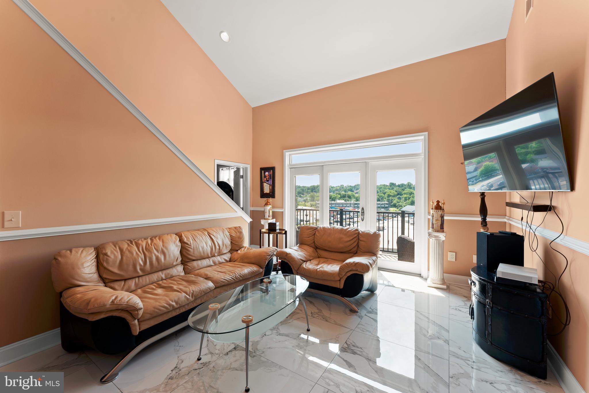 516 Carson Terrace Huntingdon Valley, PA 19006 - Photo 4 of 29 a living room with furniture and a large window
