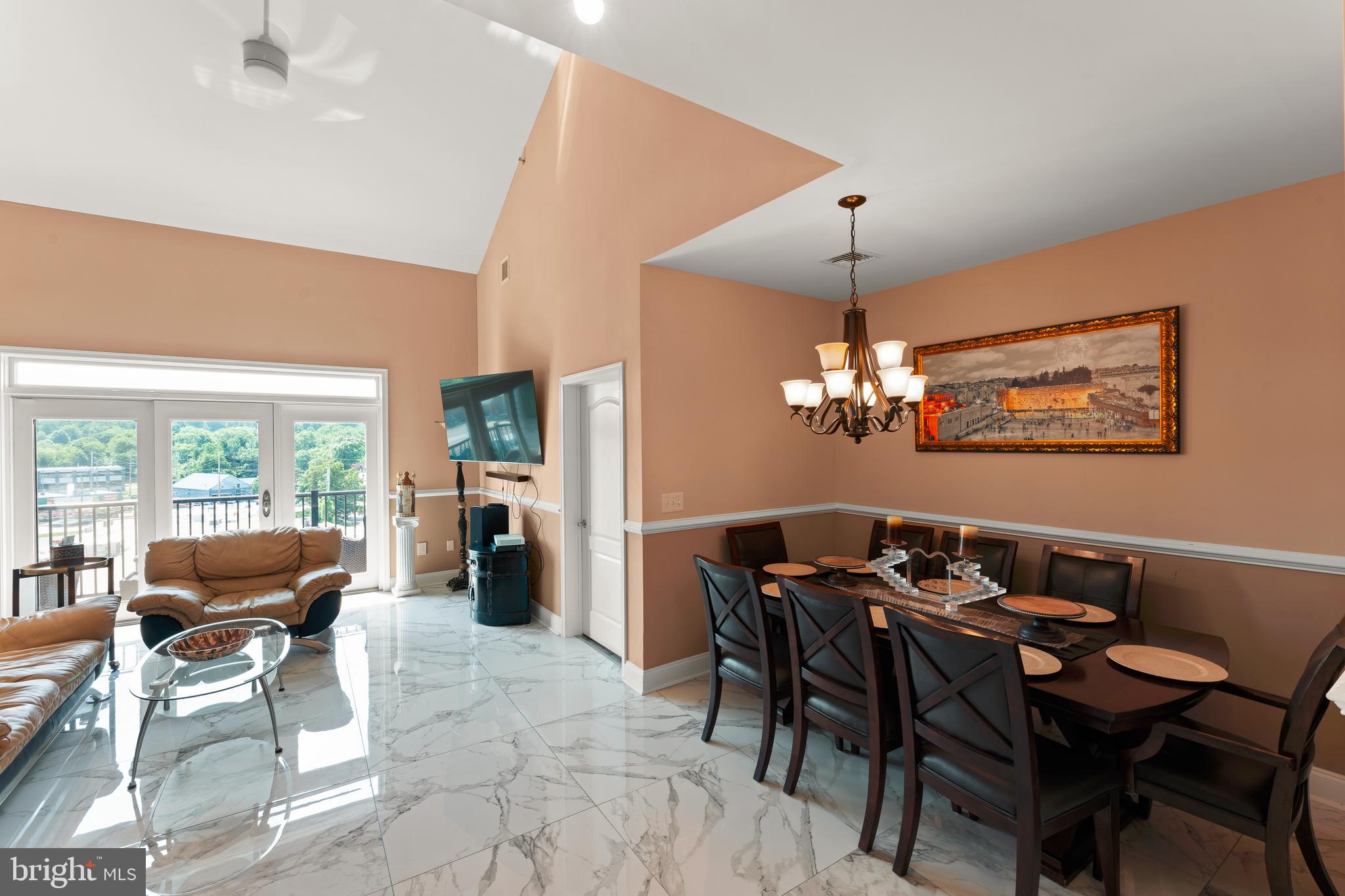 516 Carson Terrace Huntingdon Valley, PA 19006 - Photo 6 of 29 a dining room with furniture a chandelier and window