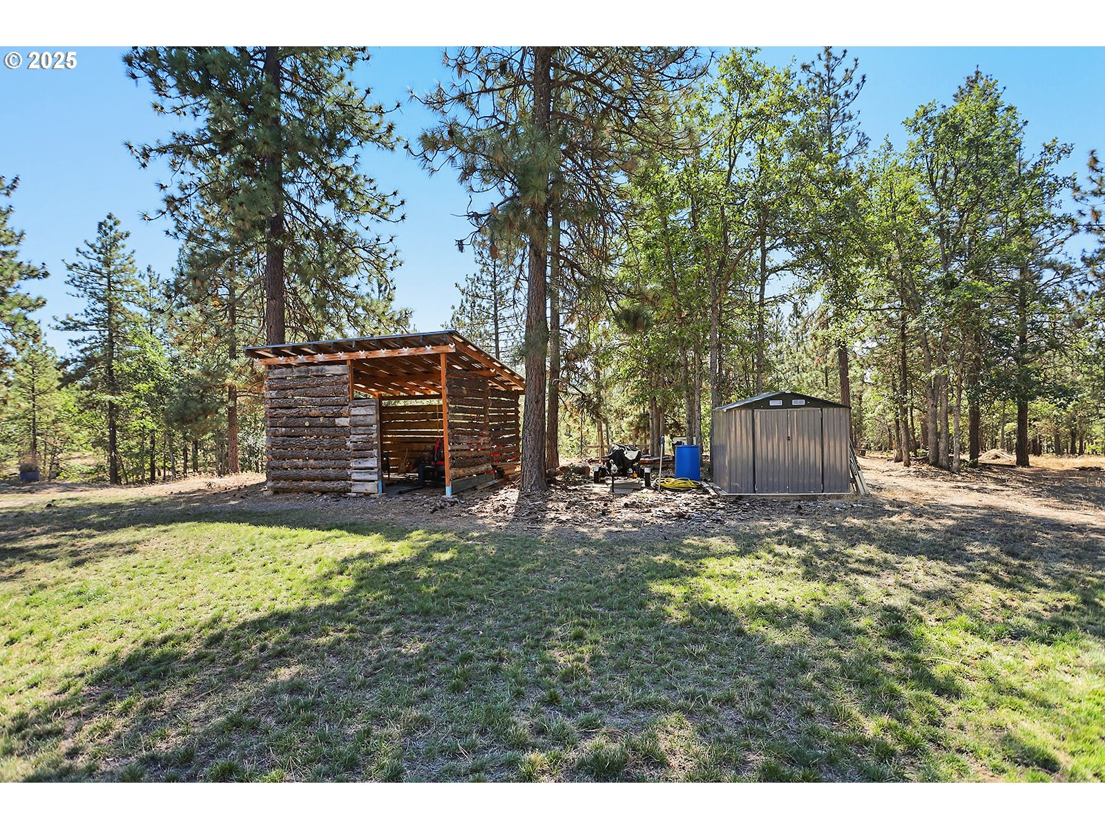 27 Whispering Pines Goldendale, WA 98620 - Photo 29 of 41 a view of a backyard with large trees