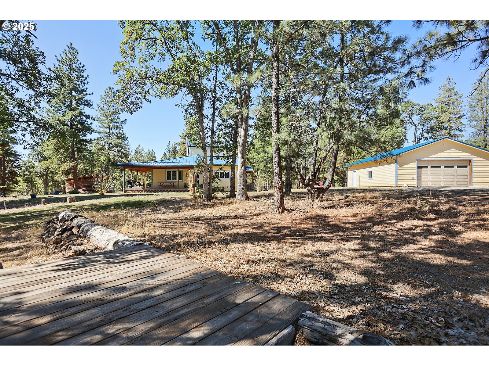 27 Whispering Pines Goldendale, WA 98620 - Photo 37 of 41 a view of house with backyard and tree