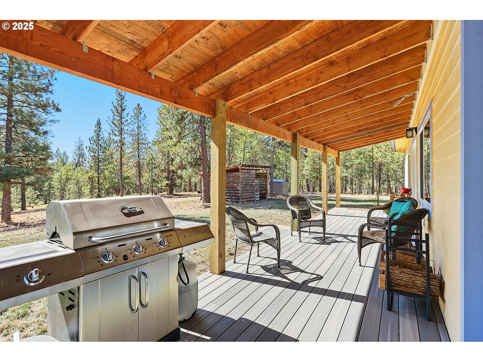 27 Whispering Pines Goldendale, WA 98620 - Photo 4 of 41 a view of a chairs and table on the deck in front of house