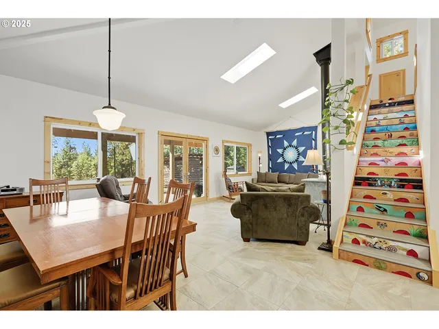 a dining room with furniture and window