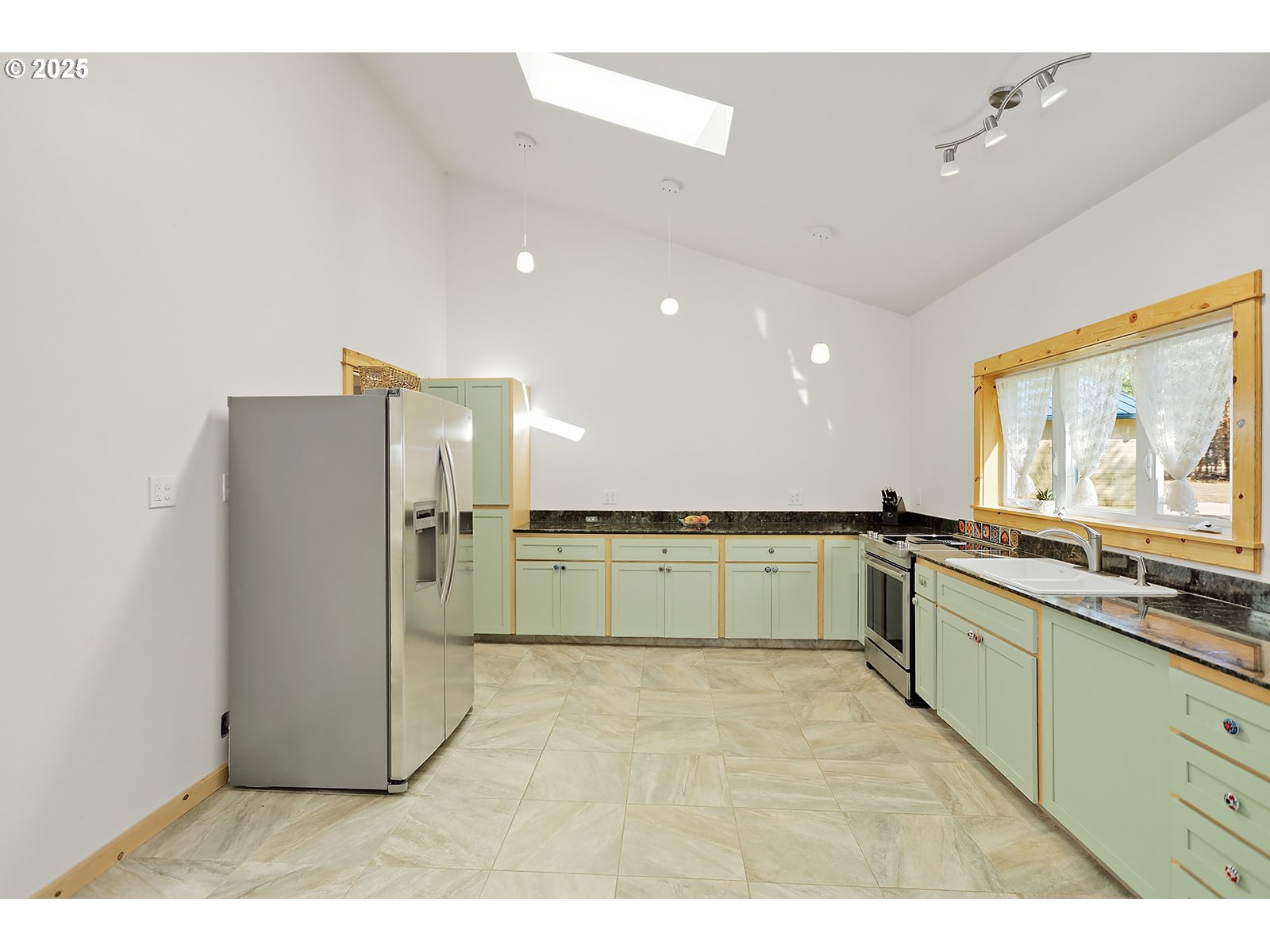 27 Whispering Pines Goldendale, WA 98620 - Photo 6 of 41 a large white kitchen with a sink and large window