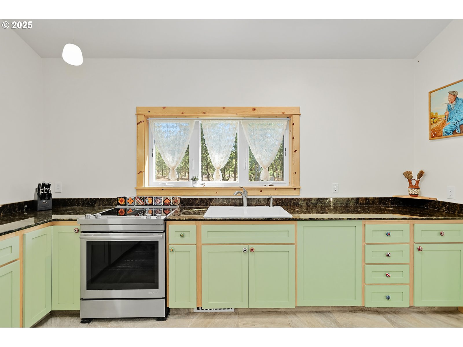 27 Whispering Pines Goldendale, WA 98620 - Photo 7 of 41 a kitchen with stainless steel appliances granite countertop a stove a sink and a microwave