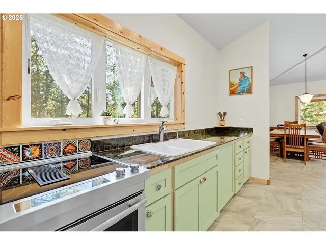a kitchen with a sink and a window