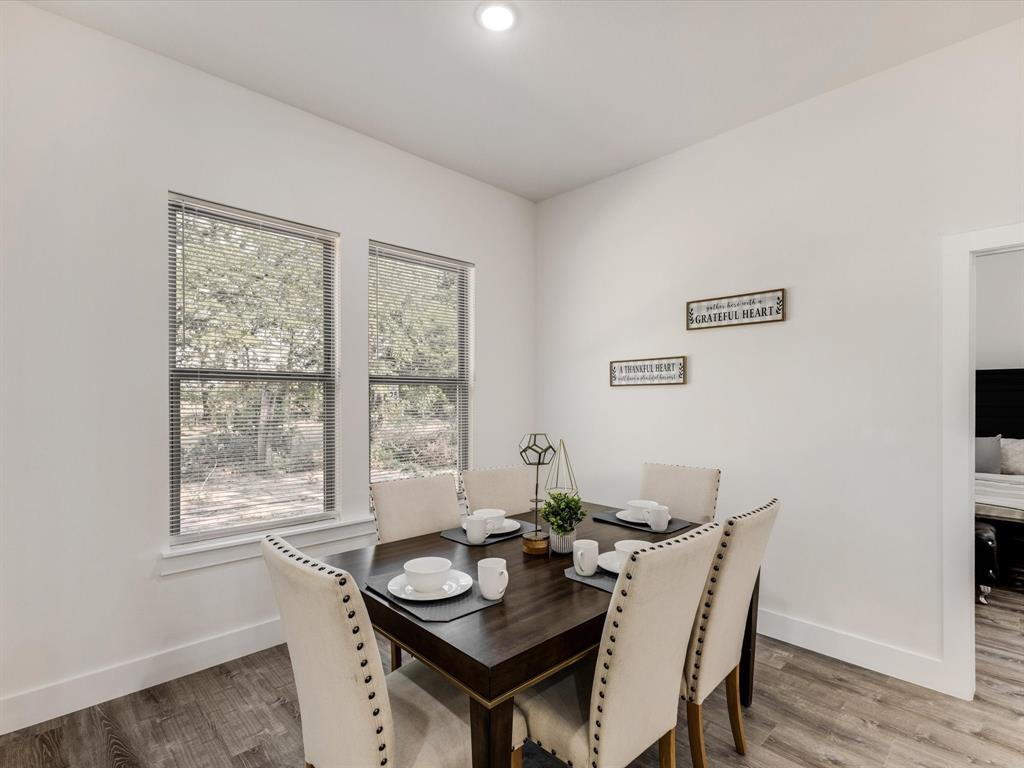 6123 Inca Drive Mabank, TX 75156 - Photo 12 of 31 a view of a dining room with furniture window and wooden floor