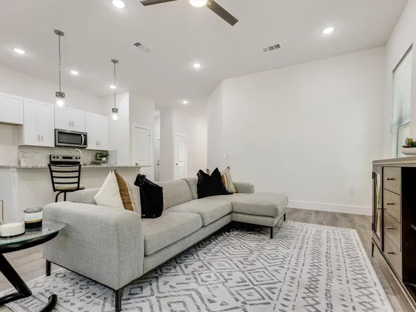 a living room with furniture and a rug