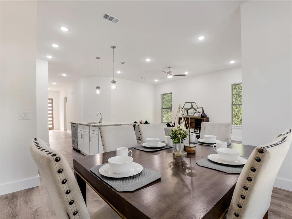 6123 Inca Drive Mabank, TX 75156 - Photo 19 of 31 a view of a dining room with furniture and a chandelier