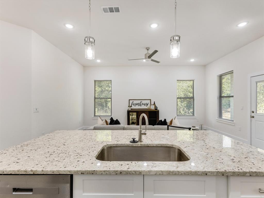 6123 Inca Drive Mabank, TX 75156 - Photo 26 of 31 a kitchen with a sink a counter space and a window
