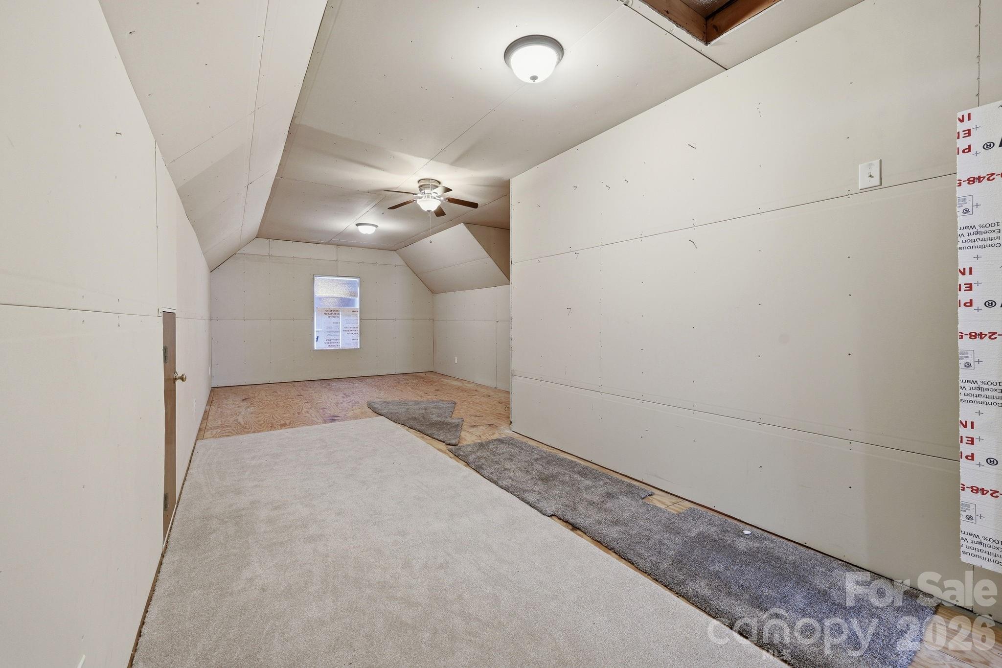 3308 Grandeur Road Charlotte, NC 28269 - Photo 32 of 45 en empty room with windows and ceiling fan